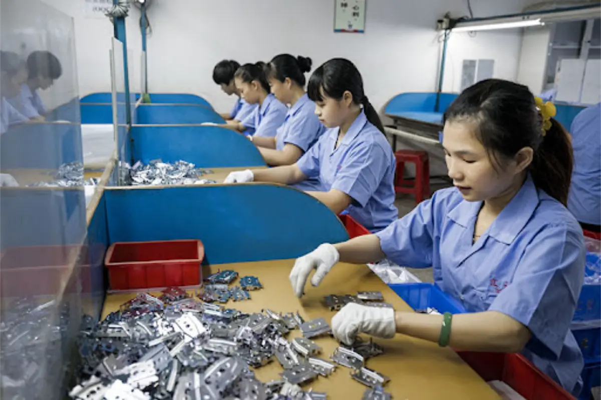 Inspector checking materials in a Chinese factory