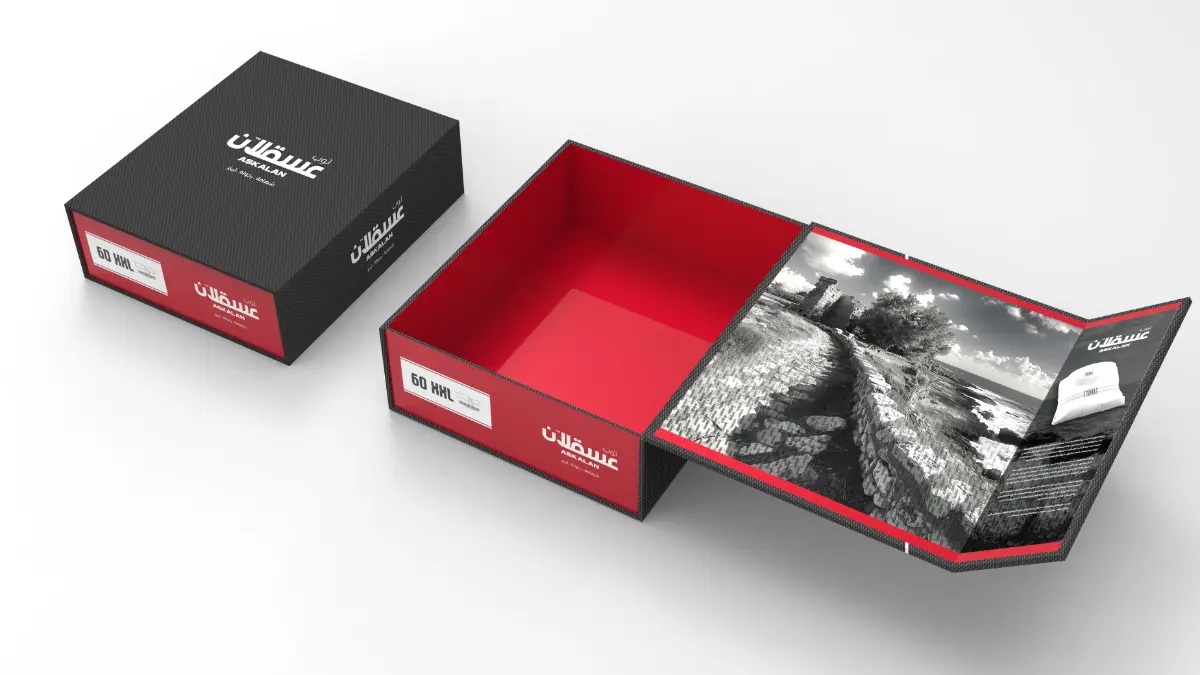 Hand holding a custom-designed, branded product box